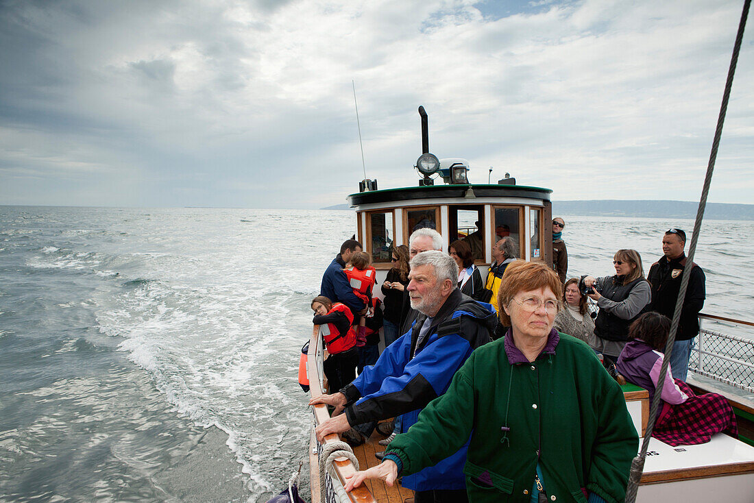 ALASKA, Homer, tourists take a ride on the Danny J boat from the Homer Spit to Halibut Cove