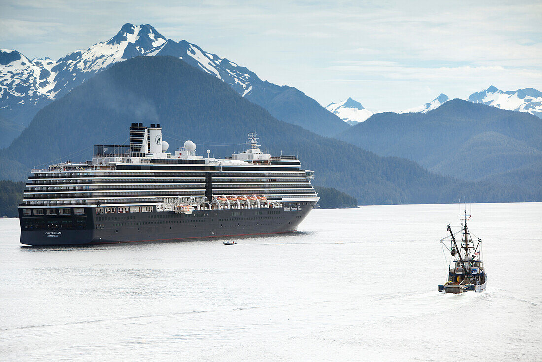 ALASKA, Sitka, a fishing boat passes by a cruise ship that is anchored for the night, Crescent Bay, Sitka Sound