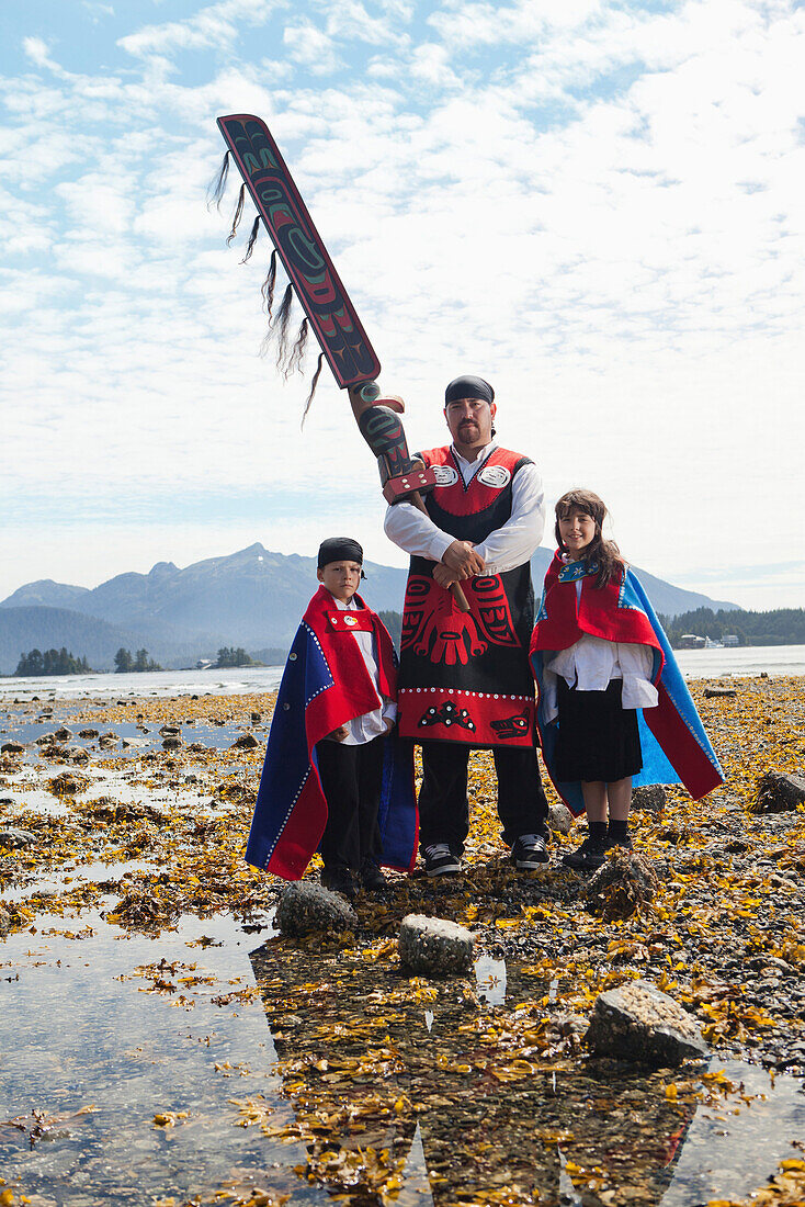 ALASKA, Sitka, Sheeta Kwan Naa Kahidi dancers in traditional costume, Nathan Howard with his son Jonathan and daughter Alice, Sitka Sound
