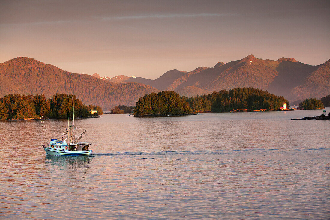ALASKA, Sitka, a fishing boat makes it's way to the Sitka Harbor, Crescent Bay, Sitka Sound