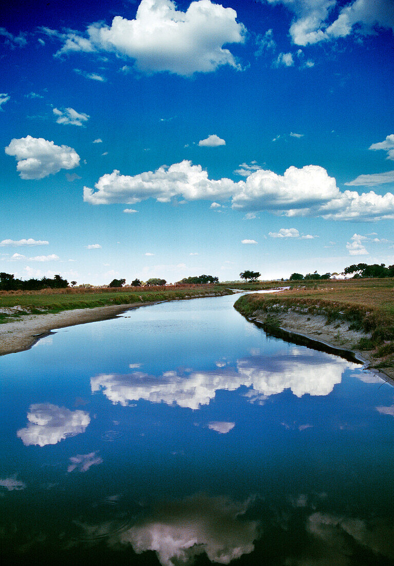 BOTSWANA, Africa, Okavango Delta, Clouds reflecting in the Okavango River