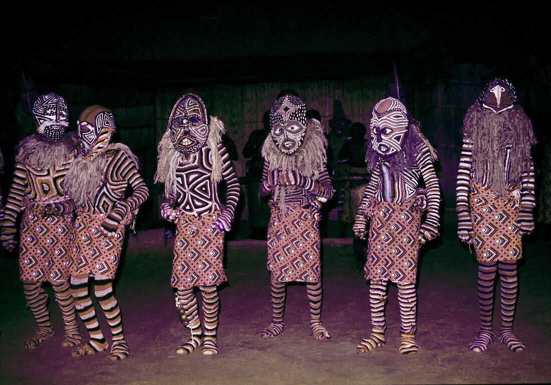 BOTSWANA, Africa, a group of indigenous men in ceremonial dress, Okavango Delta