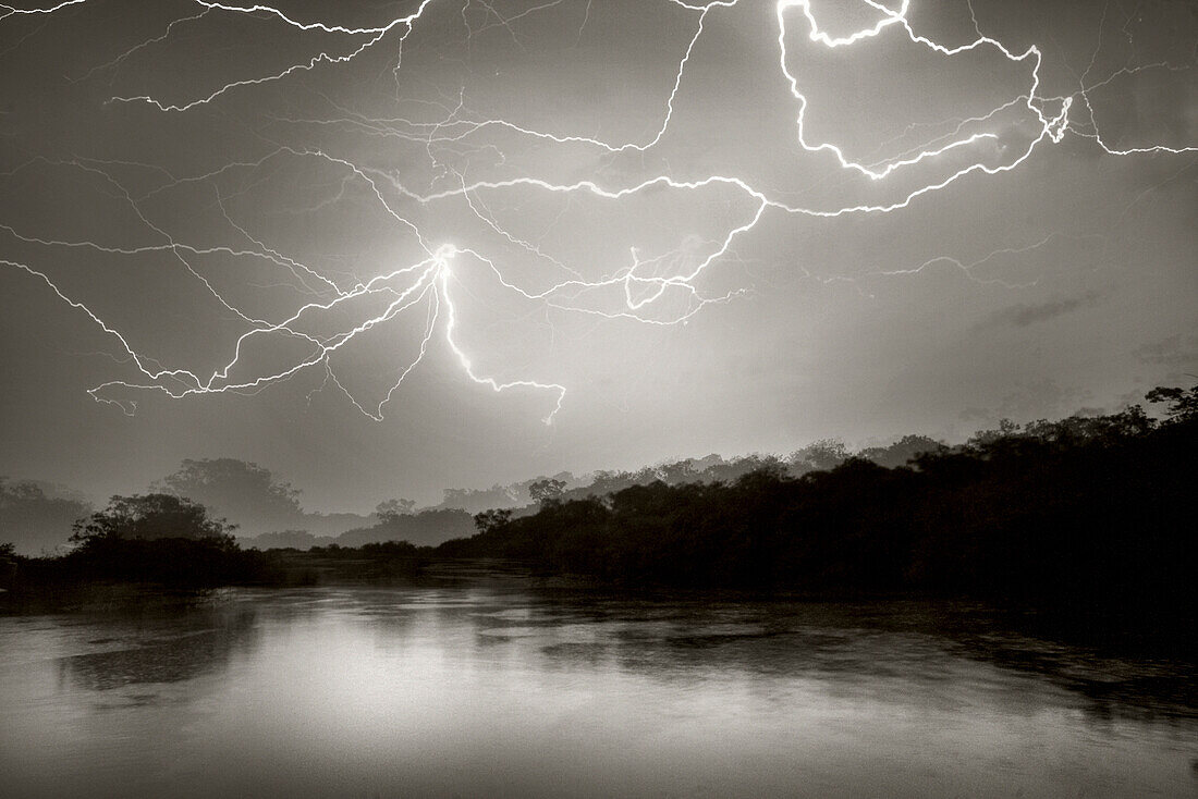 BRAZIL, Agua Boa, Amazon, Agua Boa River, lightning and rain storm in the deep Amazon jungle (B&W)