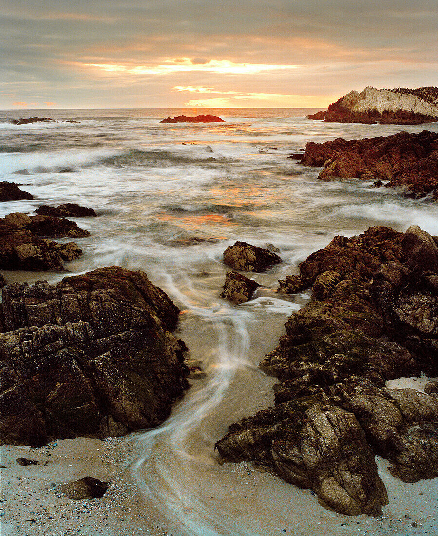 USA, California, Pebble Beach, rock formations on Pacific Ocean at sunset, Hwy 1, 17 mile drive