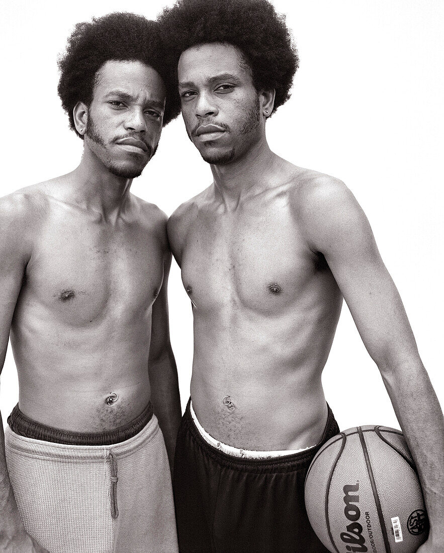 USA, California, portrait of twin brothers holding basketball, Pasadena (B&W)