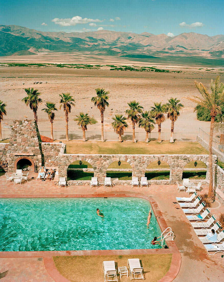 USA, California, Death Valley National Park, family in swimming pool, Furnace Creek Inn