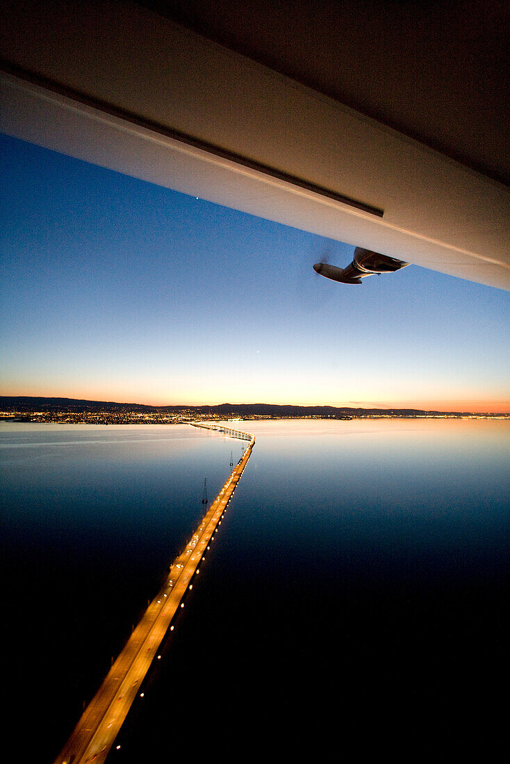 USA, California, San Francisco, flying over San Francisco Bay at night in the Airship Ventures Zepplin, Sam Mateo Bridge