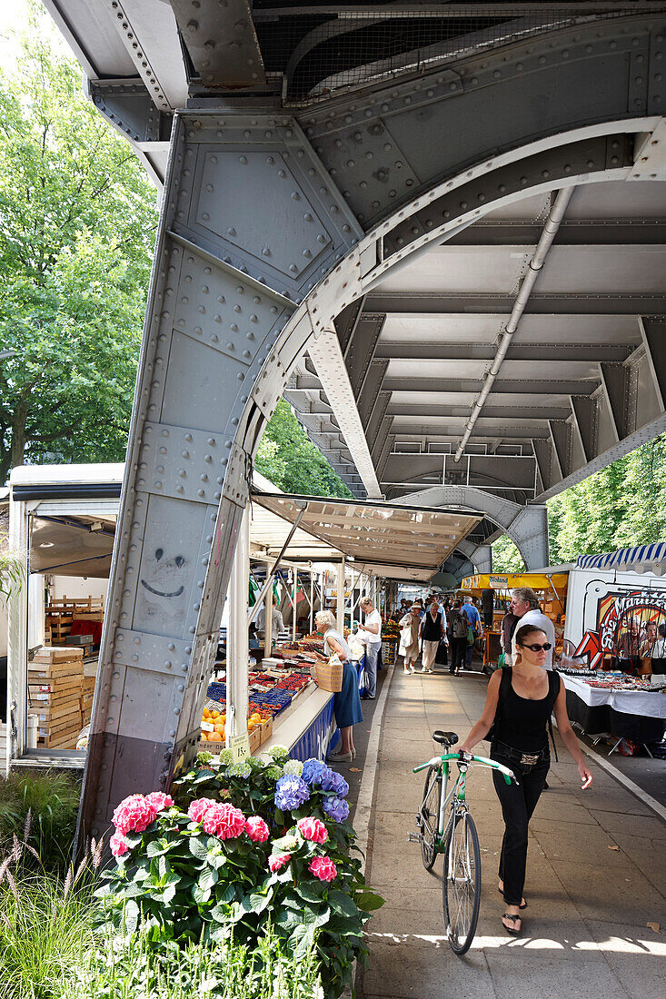 Market stalls below urban railway system, farmers market in Isestrasse, Eppendorf, Hamburg, Germany