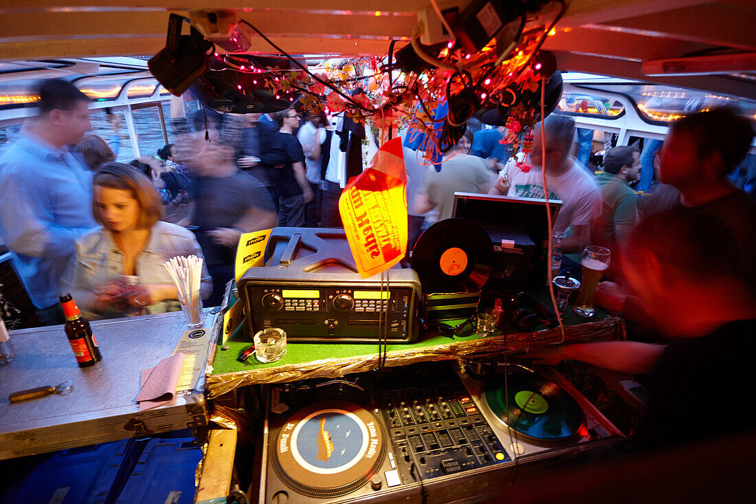 Party barge Frau Hedi, DJs putting on records during the harbour cruise, Hamburg, Germany