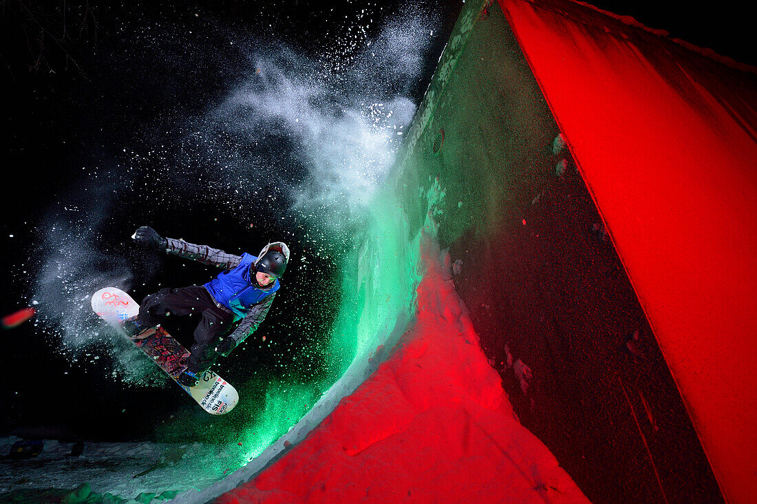 Snowboarder jumping, Rosenheim, Upper Bavaria, Bavaria, Germany