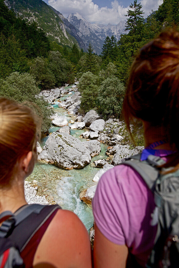 Two female hikers beside the river Soca, Alpe-Adria-Trail, Tolmin, Slovenia