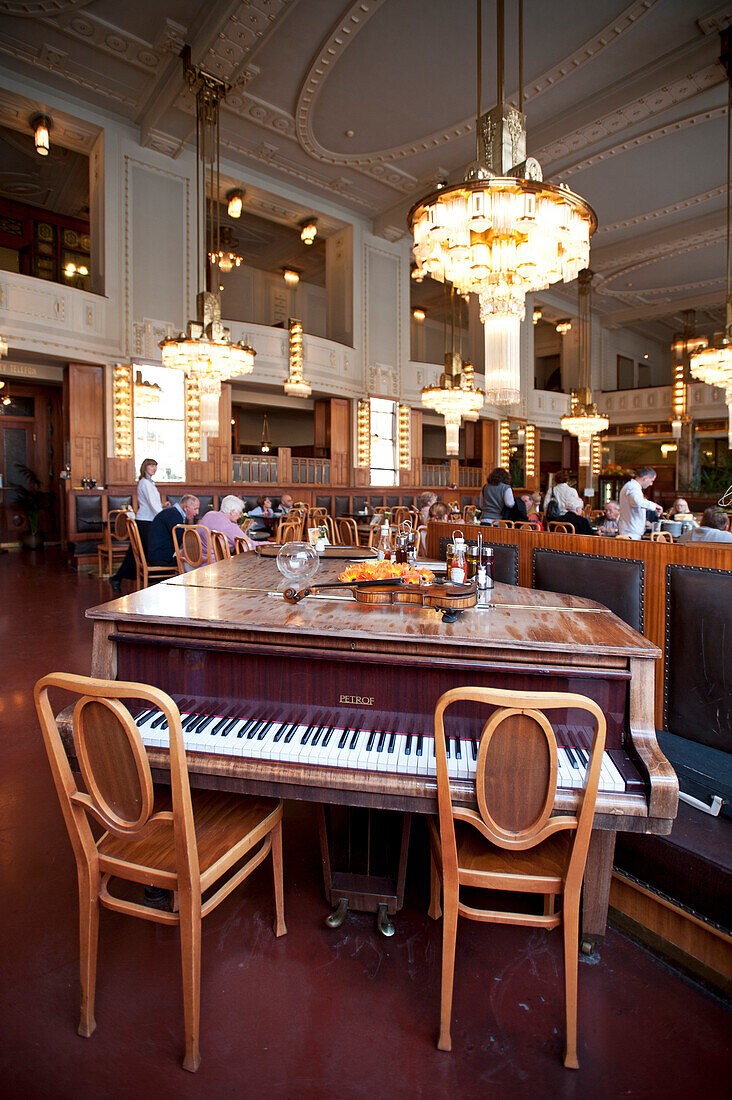 Piano in an art nouveau cafe in the old city of Prague, Prague, Czech Republic, Europe