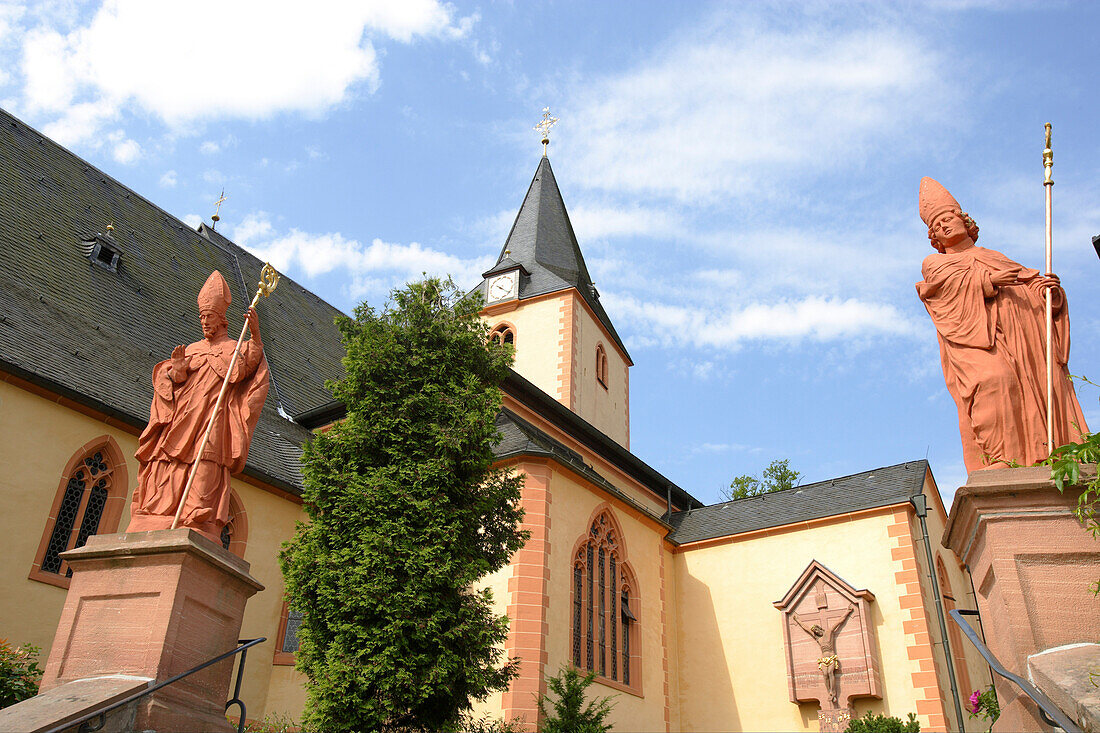 Bishop statues on the steps to the church of St. Martin, historic old town of Bad Orb, Spessart, Hesse, Germany