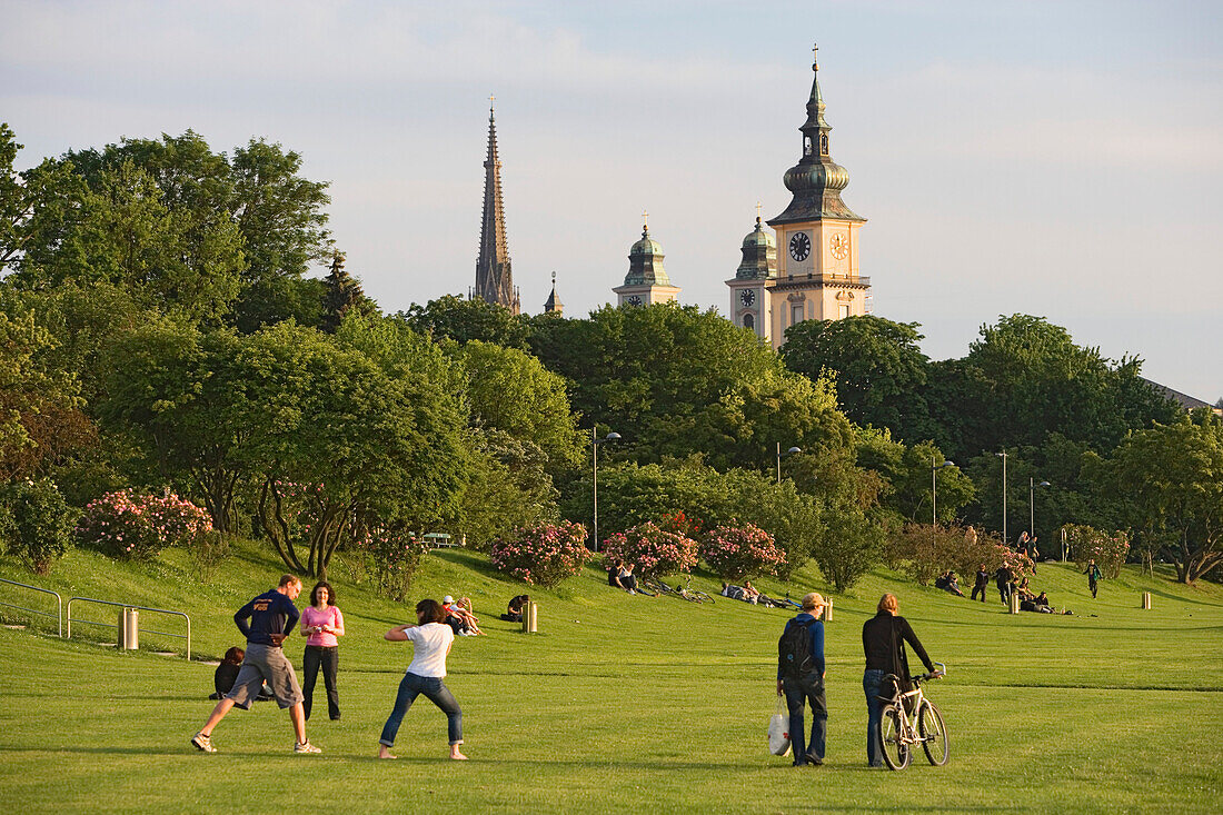 The flood zone of the Danube is normally a green park. Steeples of the new cathedral, Mary-Immaculate-Conception and parish church in the background, Linz, Upper Austria, Austria