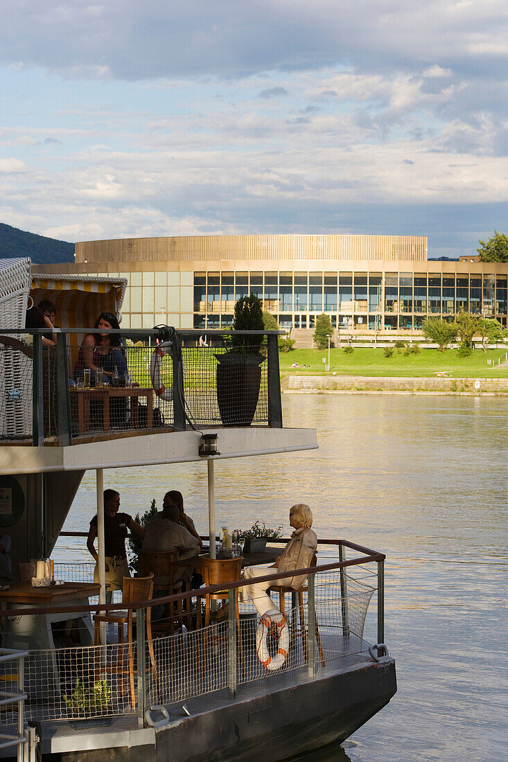 Cafe Lido on the river Danube and the Bruckner concert hall, Linz, Upper Austria, Austria
