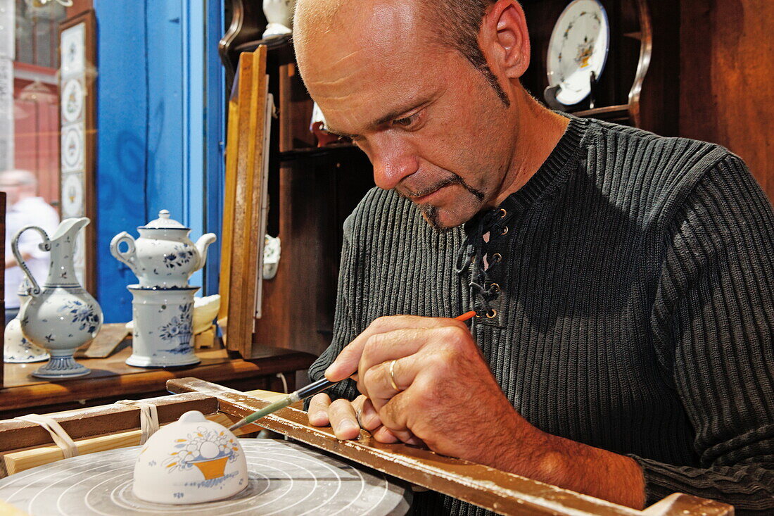 Painting faiences in an atelier in Rouen, Seine-Maritime, Normandy, France