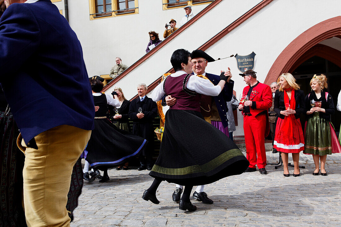 Dancers celebrating Easter on the market square, Volkach, Lower Franconia, Bavaria, Germany