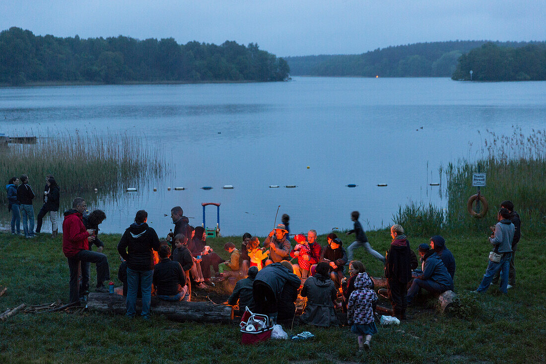 Campfire at campground at lake Ellbogensee, Mecklenburg Lake District, Mecklenburg-Western Pomerania, Germany