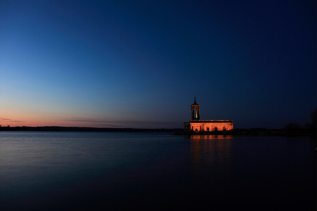 Sunset over Normanton church, Rutland Water Reservoir, Rutland County, England, UK