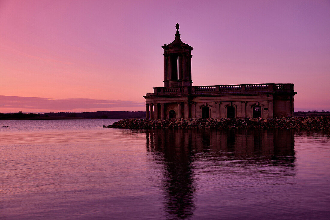 Sunset over Normanton church, Rutland Water Reservoir, Rutland County, England, UK