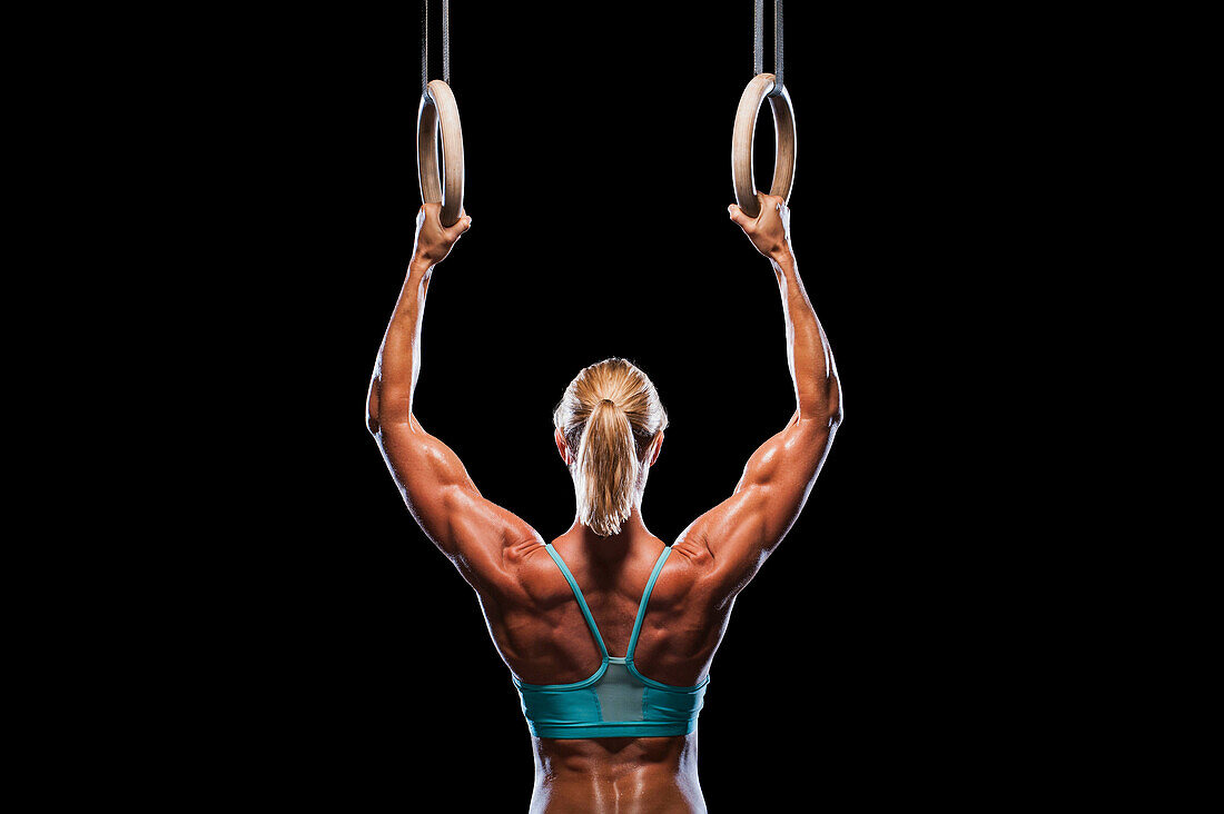 Woman using exercise rings