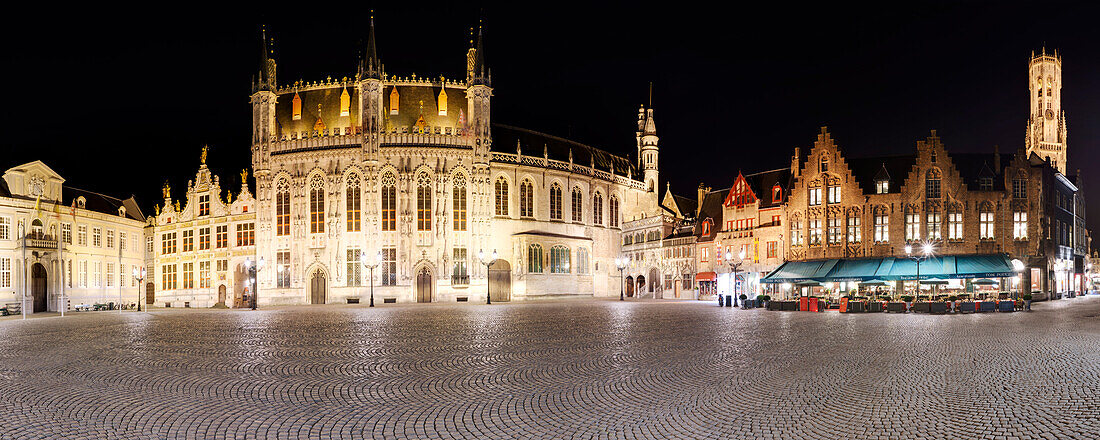 Panorama of the vast castle square in the historic center of Bruges with the Belfry tower in the background, Flanders, Belgium