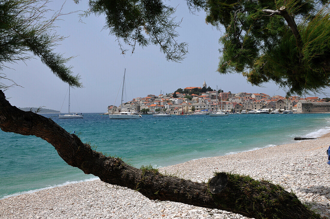 View across a beach towards Primosten, Dalmatia, Adriatic Coast, Croatia