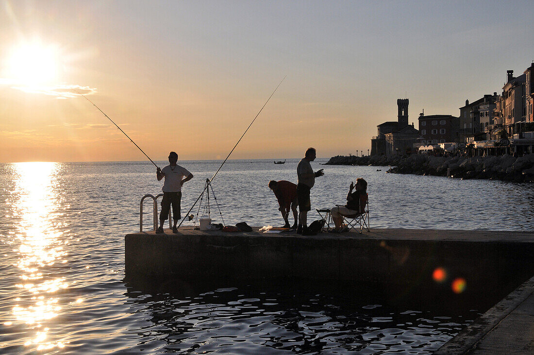 Men fishing on the jetty, Piran, Gulf of Triest, Slovenia