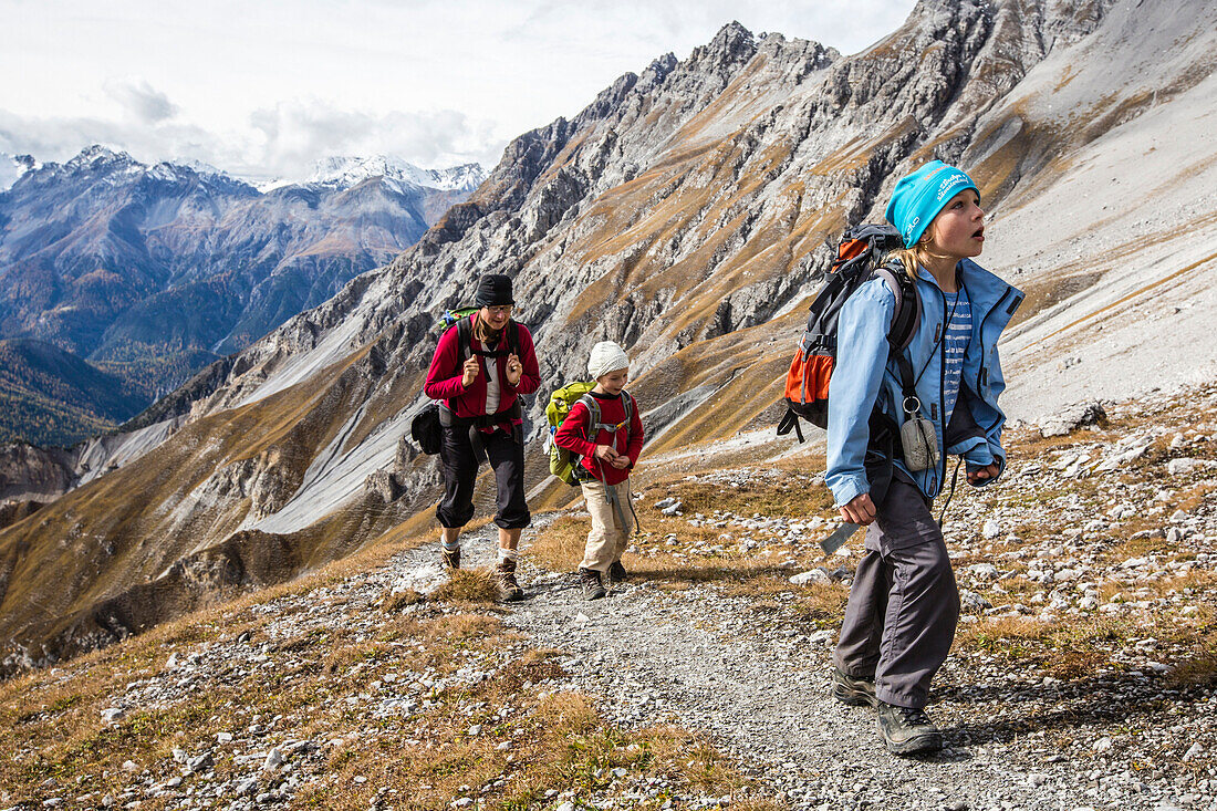 Woman and two girls hiking at Fuorcla Val da Botsch, Swiss National Park, Canton of Grisons, Switzerland