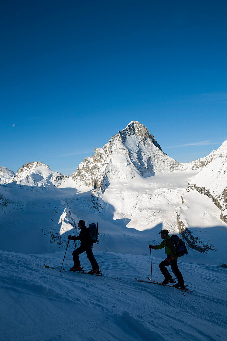 Two skier ascending, glacier Durand and Dent Blanche in background, Val d Anniviers, Canton of Valais, Switzerland