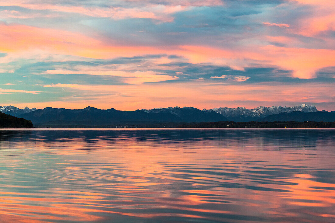 View over lake Starnberg to the Alps in dust, Bavaria, Germany