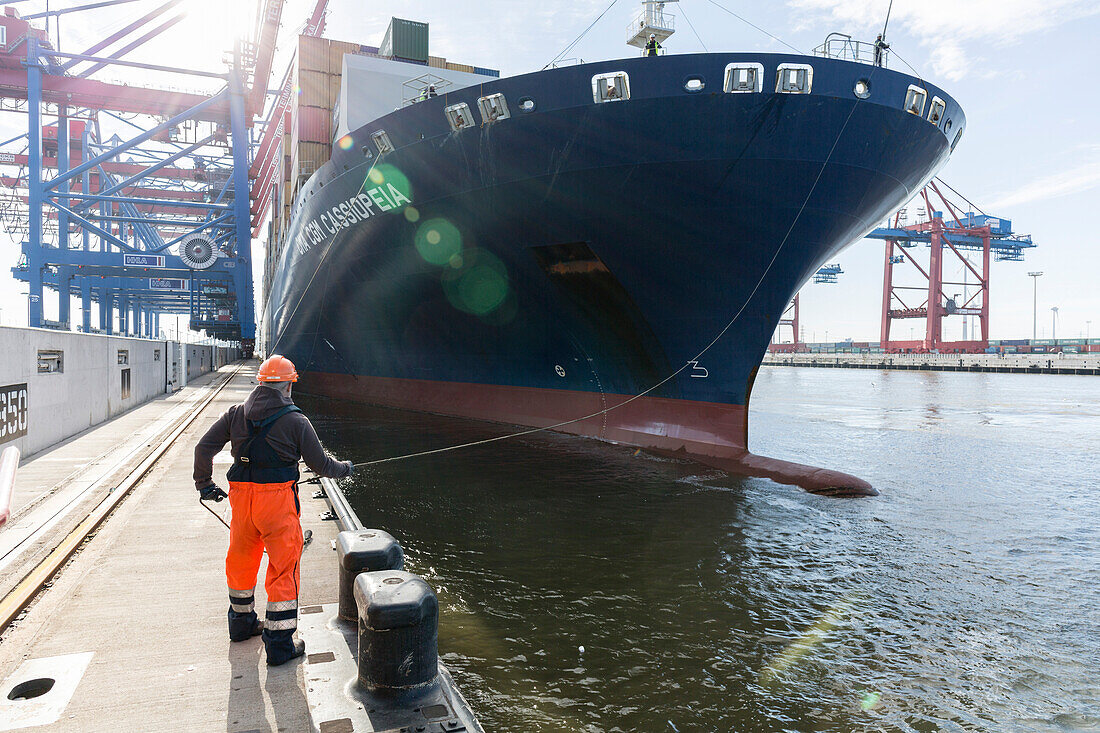 Worker fixed the mooring line of CMA CGM Cassiopeia in Hamburg, Burchardkai, Hamburg, Germany