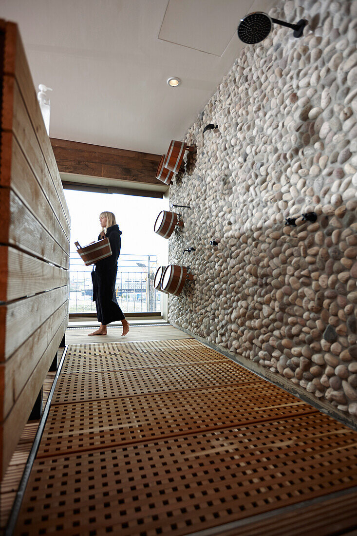 Woman inside a spa area with sauna in a hotel, HafenCity, Hamburg, Germany