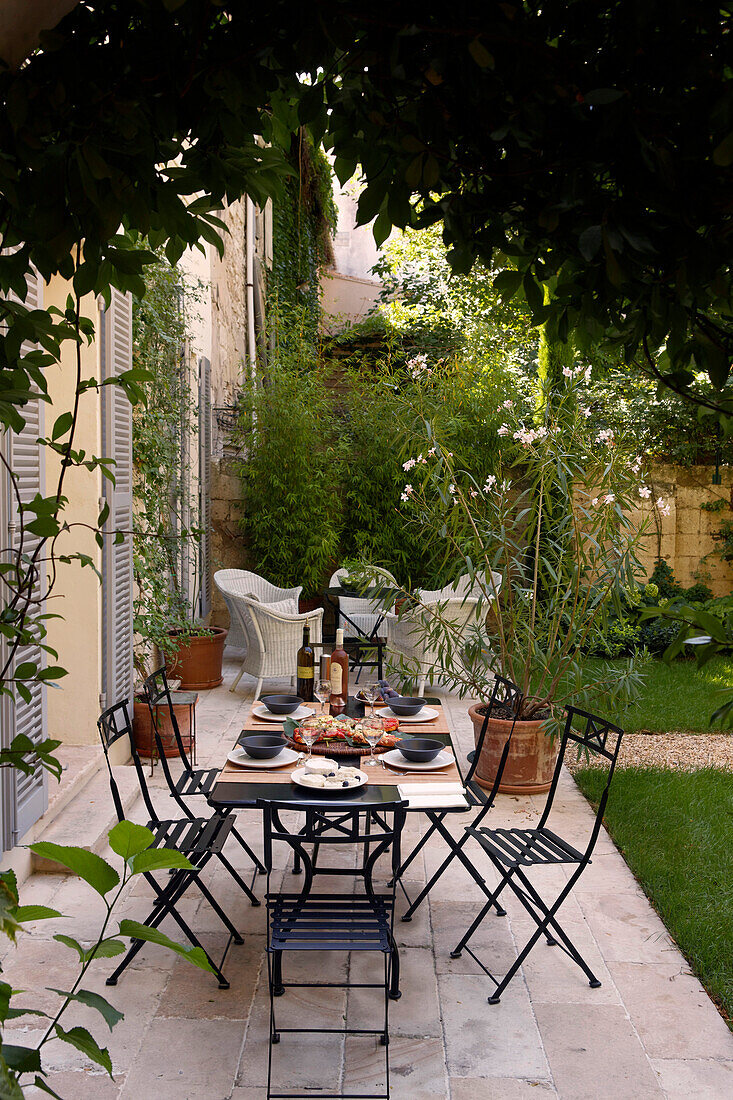 Terrace of a house with a table laid for lunch