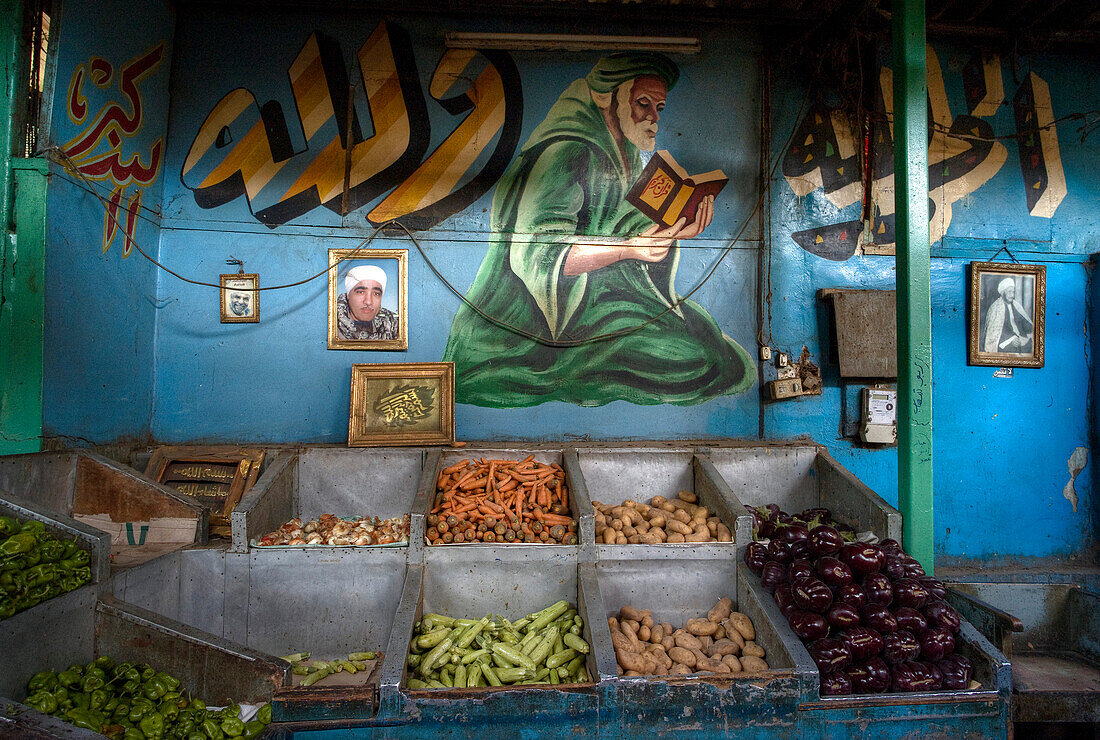 Arab Republic of Egypt, Cairo, Islamic District, Fruit and Vegetable store, Painting of a islamist man praying