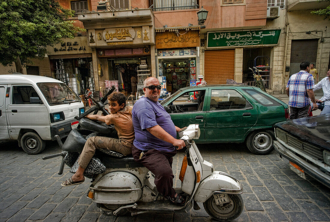 Arab Republic of Egypt, Cairo, Islamic District, People on a motor scooter