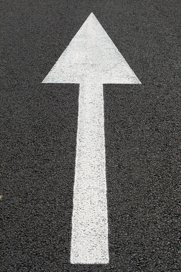 France, Road marking on asphalt in the form of an arrow