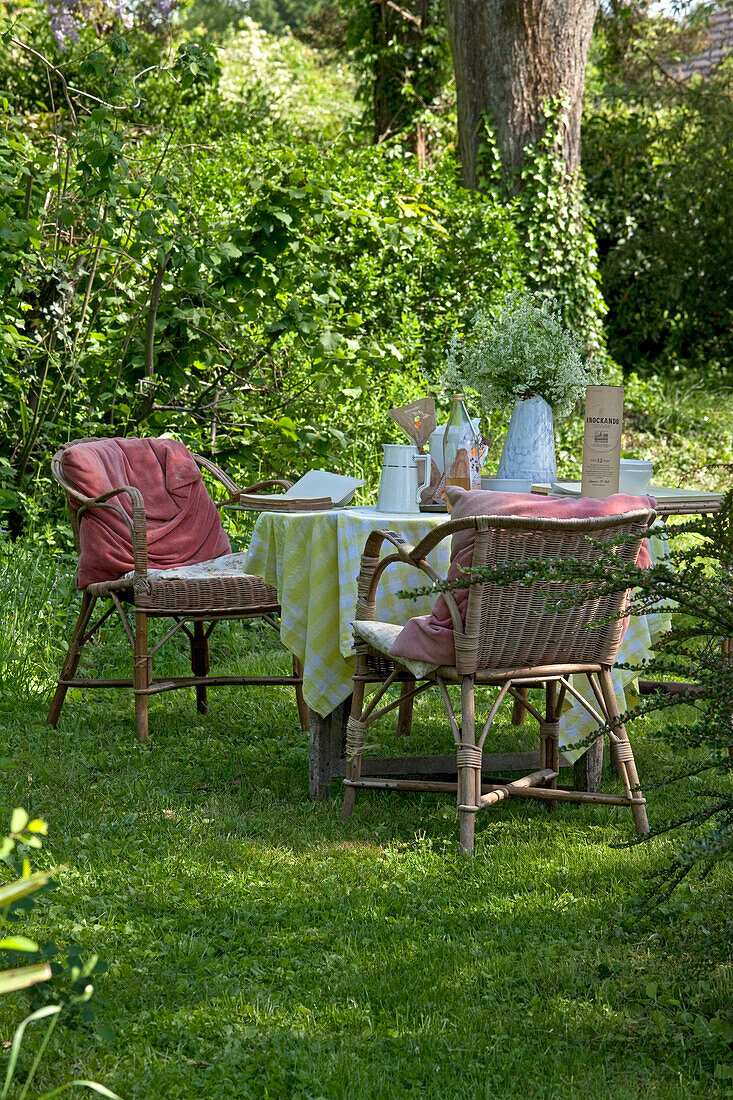 Rattan table and chairs in a  private garden