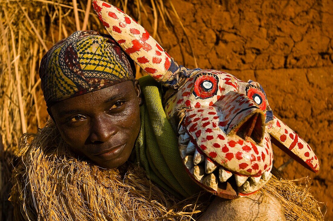 Benin, Zou County, Bagon Dovi Cove, Parfait Sossu wears the costume of the Hla Hyena during a Guelede danced masquerade