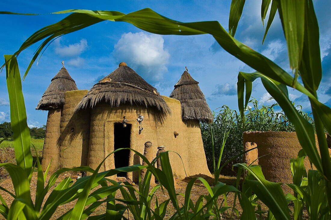 Benin, Atacora County, Koutagou, children playing hide-and-seek in front of a Tata Somba made with banco (mud mixed with straw), typical defensive storeyed house of the Northern Benin