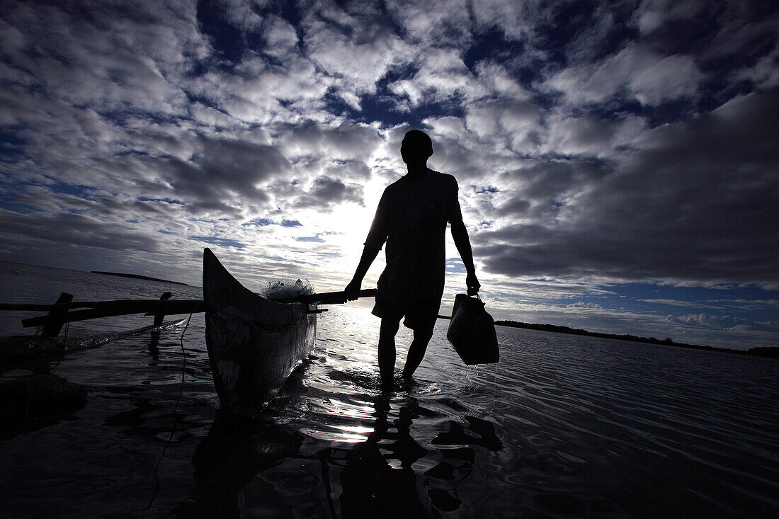 Republic of Madagascar, Diana Region, Diego Suarez Bay, Fisherman, backlighting