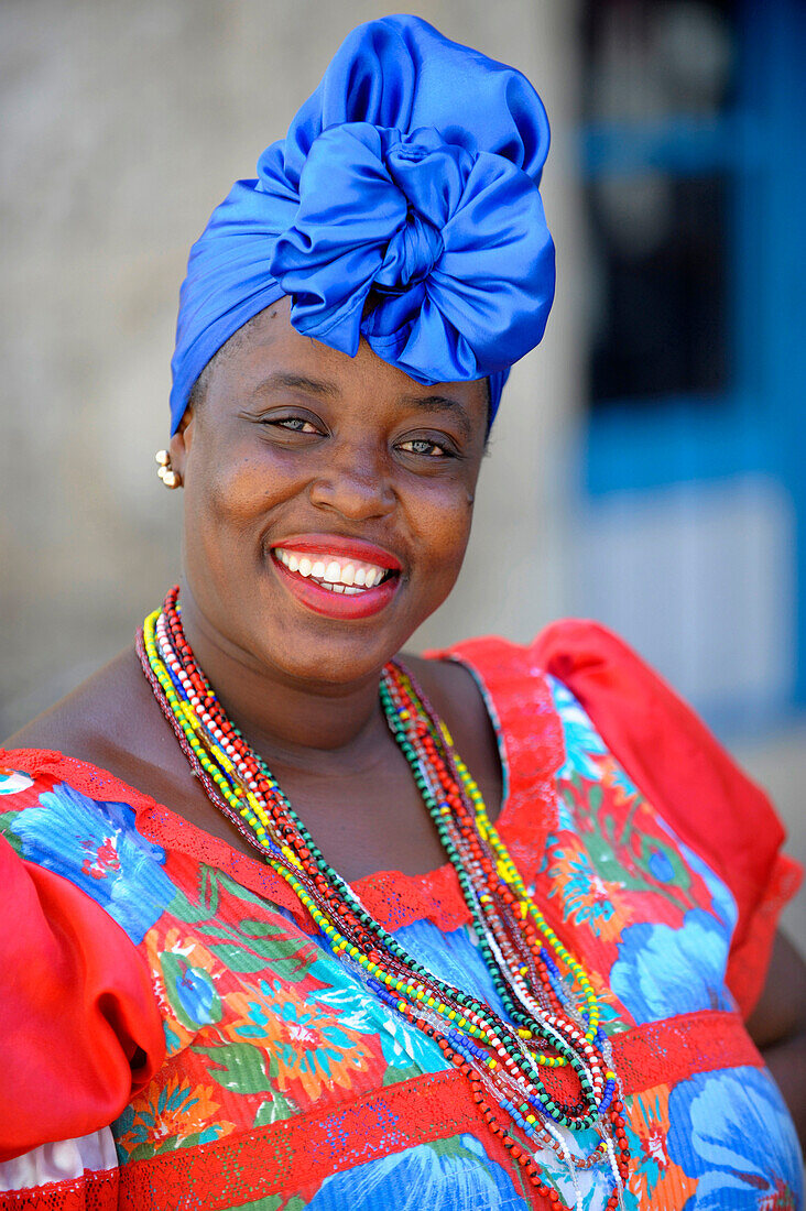 Beautiful caribbean woman in colorful dress in Havana, Cuba