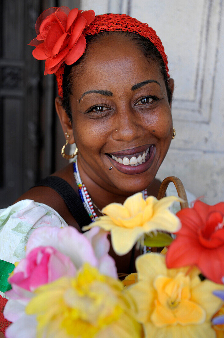 Beautiful caribbean woman in colorful dress in Havana, Cuba