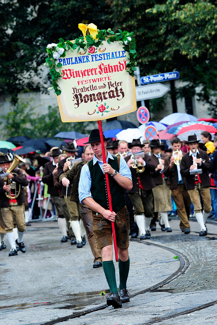 Procession wearing traditional costumes in Oktoberfest festival in Munich, Germany