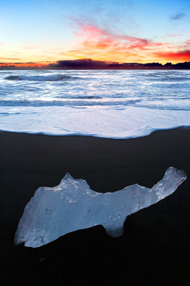 Iceland.  Southeastern Region. Jokulsarlon. Block of ice on the volcanic beach.