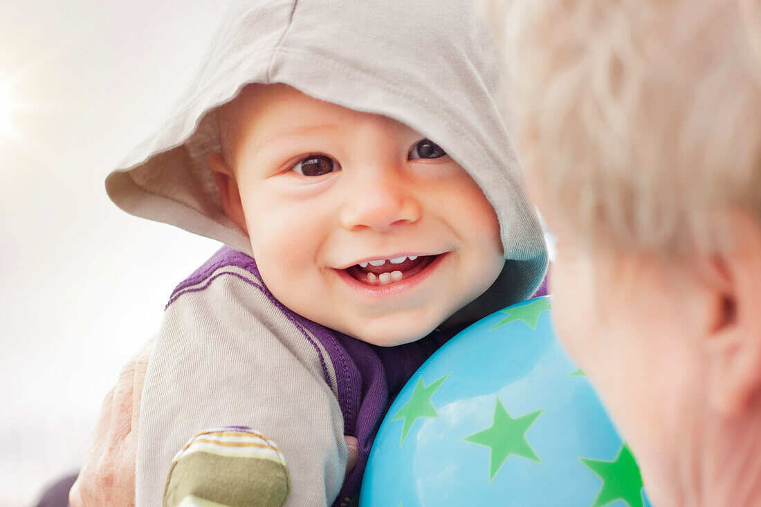 Close up of baby boy’s smiling face
