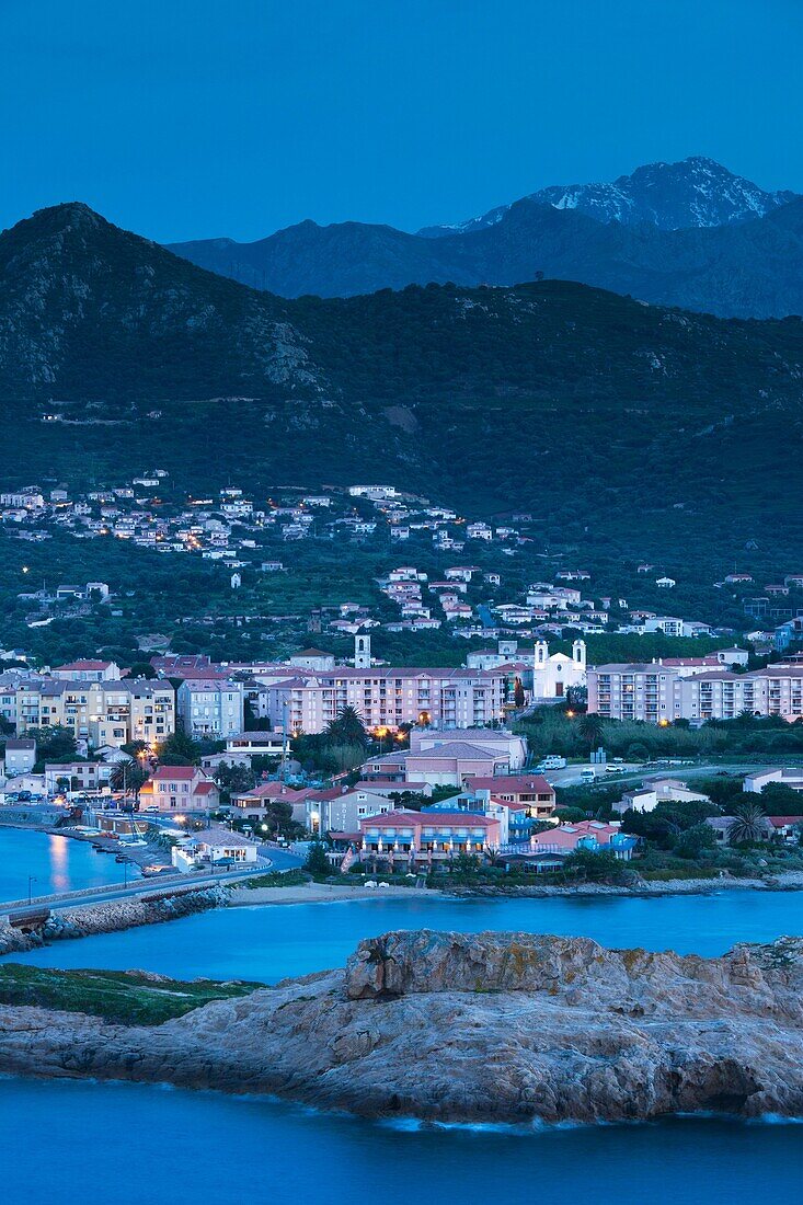 France, Corsica, Haute-Corse Department, La Balagne Region, Ile Rousse, city view from Ile de la Pietra, dusk