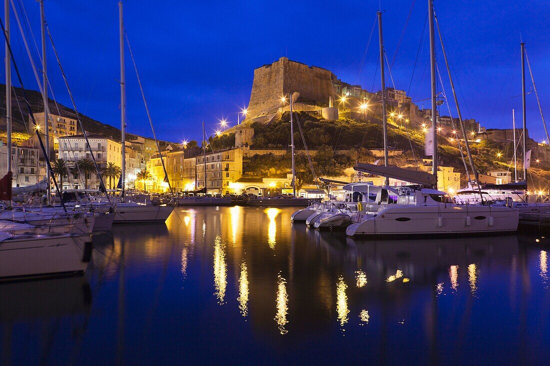 France, Corsica, Corse-du-Sud Department, Corsica South Coast Region, Bonifacio, port and Citadel, dusk