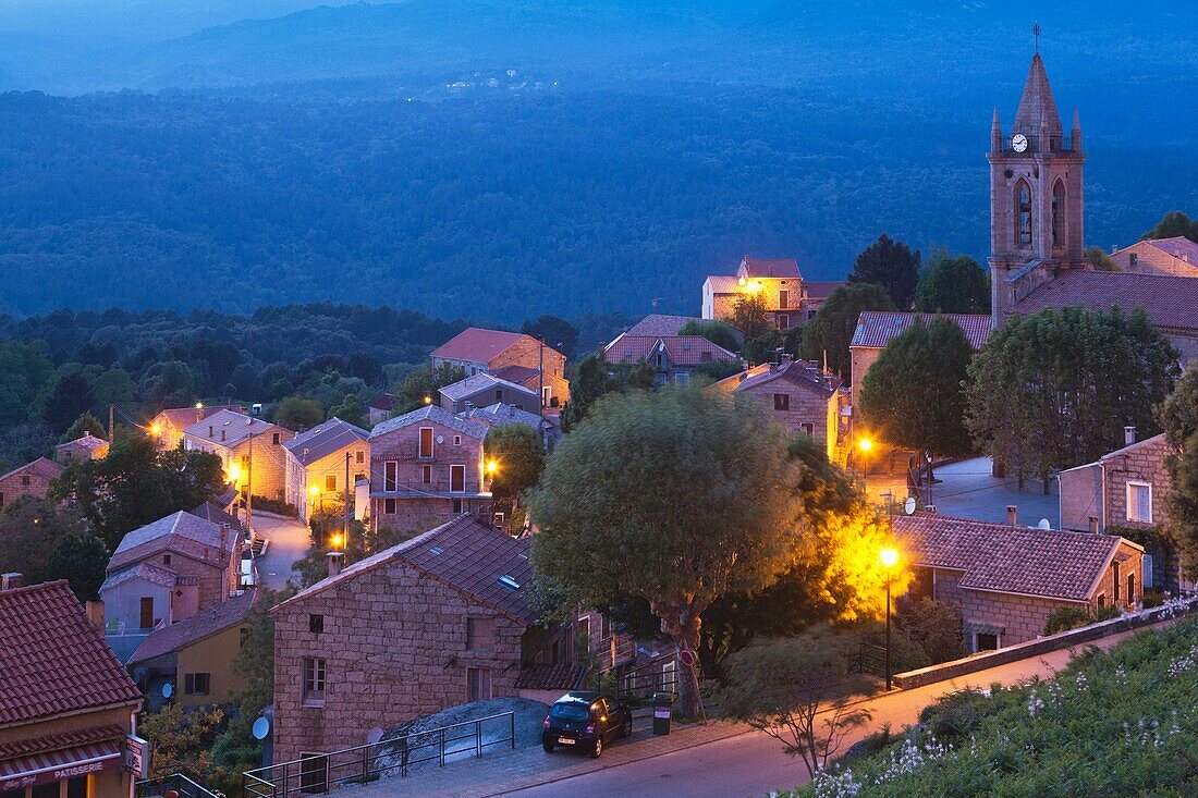 France, Corsica, Corse-du-Sud Department, La Alta Rocca Region, Zonza, elevated town view, dusk
