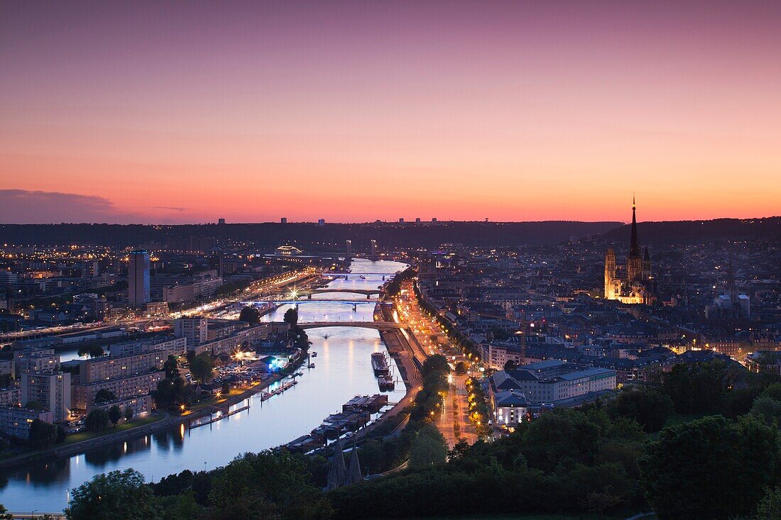 France, Normandy Region, Seine-Maritime Department, Rouen, elevated city view with Cathedral and Seine River, dusk